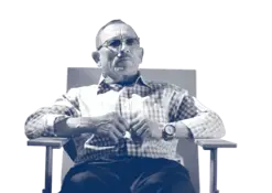 Chevo Pastrano Senior sitting in a chair