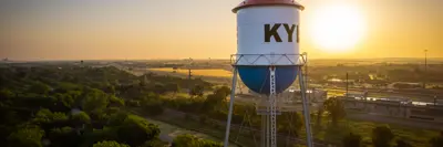 A view of Kyle Watertower at sunrise, with the sun the background.