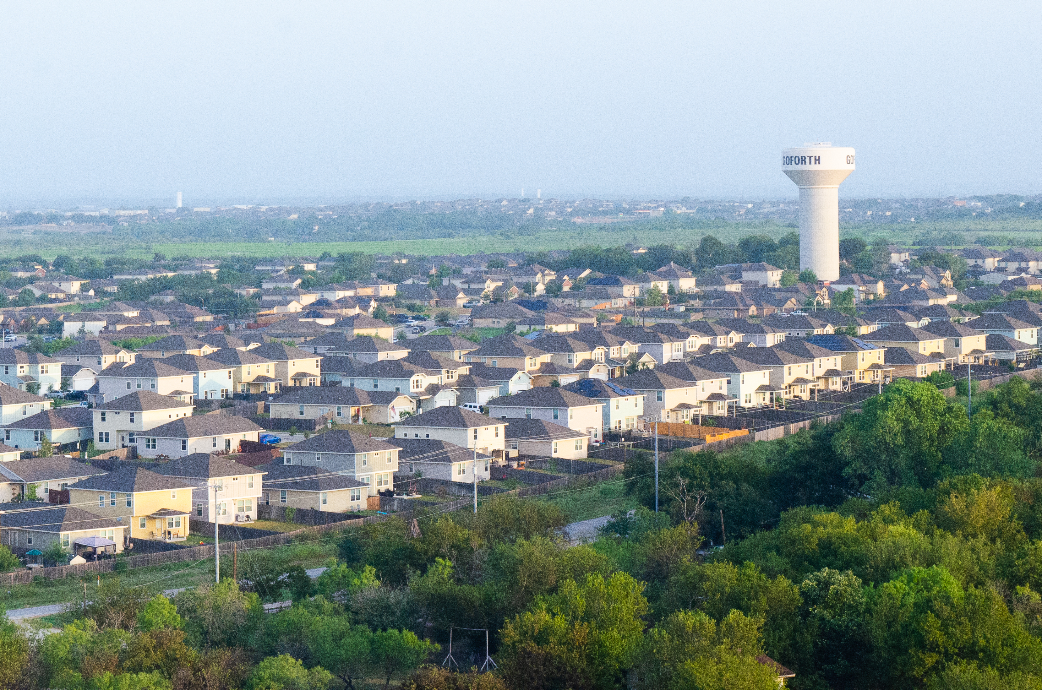 A skyline view of the tops of houses.