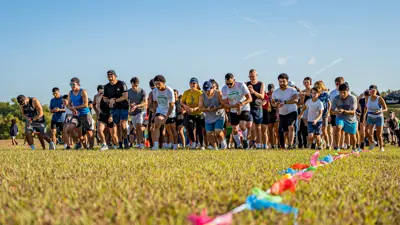 A group of runners line up for the Family and Fruta 5k Fun Run in Kyle, TX. 