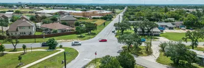 A drone photo of the five-way intersection currently in place at the Center Street West and Old Stagecoach Road in Kyle, TX during a beautiful sunny day. 