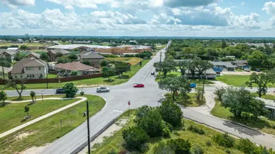 A drone photo of the five-way intersection currently in place at the Center Street West and Old Stagecoach Road in Kyle, TX during a beautiful sunny day. 