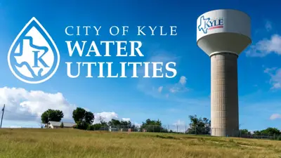 Photo of a large water tower in Kyle, Texas, under a bright blue sky with scattered clouds and grassy foreground. The tower has the City of Kyle logo on it. On the left side of the image, white text reads 'City of Kyle Water Utilities' next to a water droplet-shaped logo containing the outline of Texas with the letter K inside.